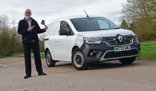 Auto Express senior road test editor Dean Gibson pointing at the Renault Kangoo E-Tech